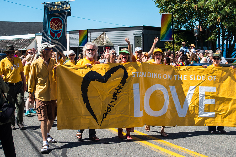 Group of people holding a love flag